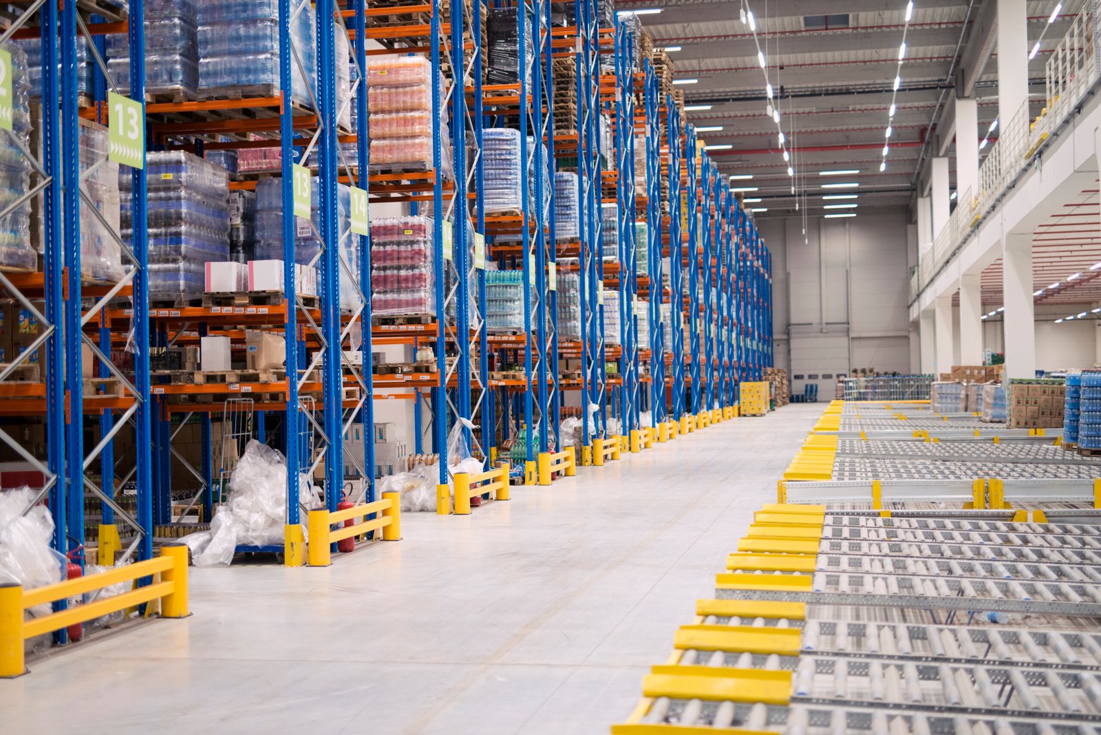 Warehouse storage interior with shelves loaded with goods.